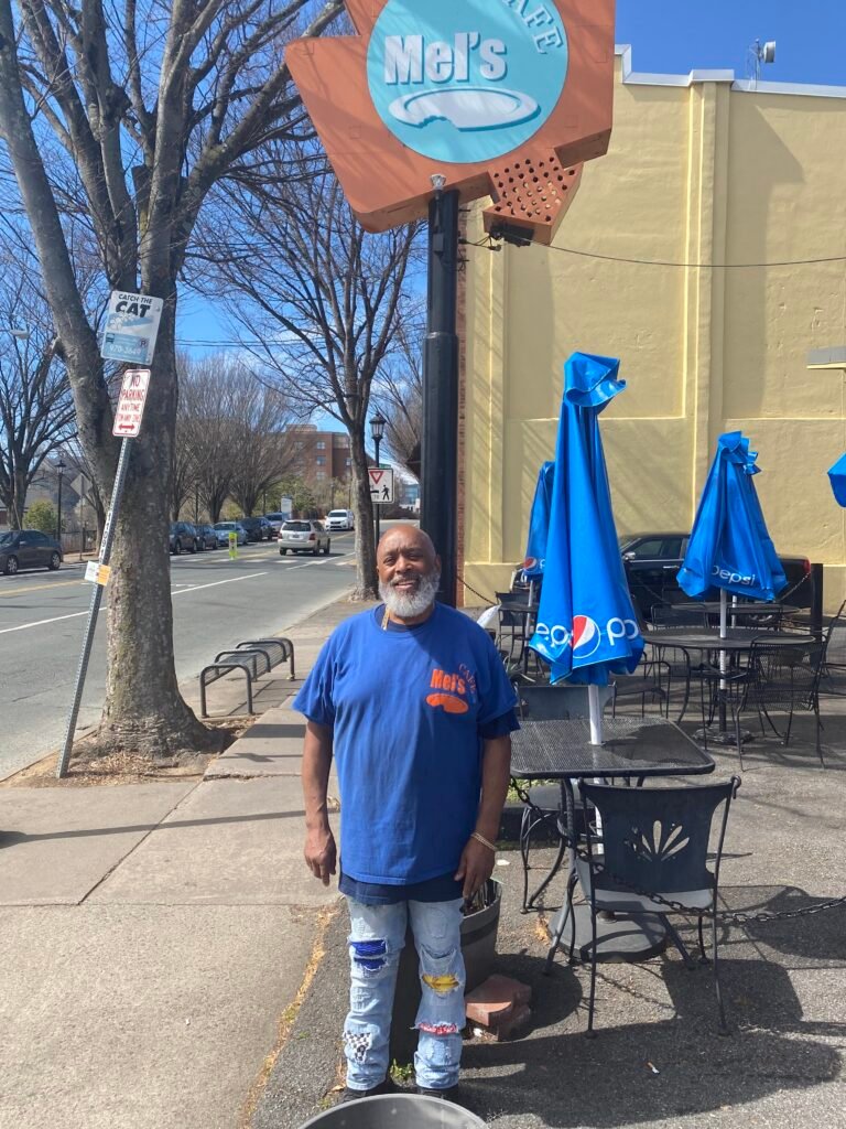 a man outside a restaurant
