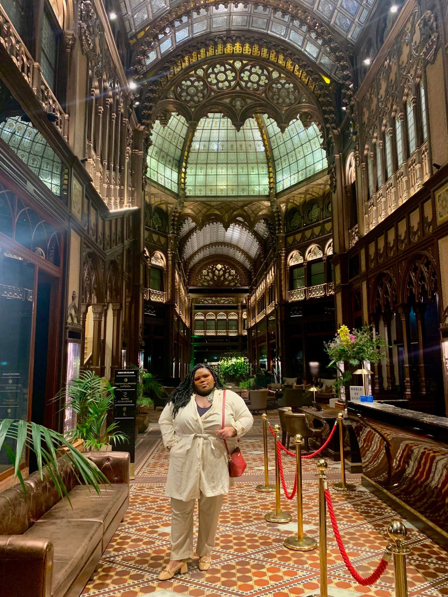 a woman stands in a passage way